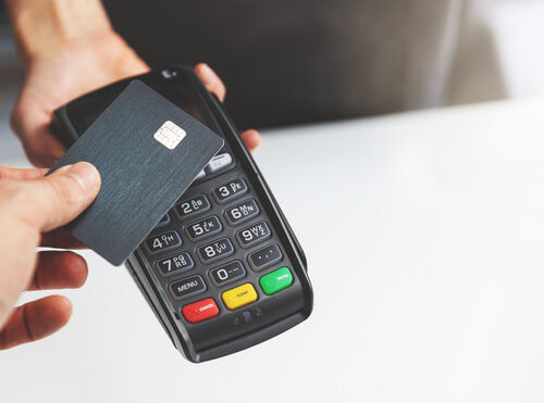nfc contactless payment by credit card and pos terminal. copy space